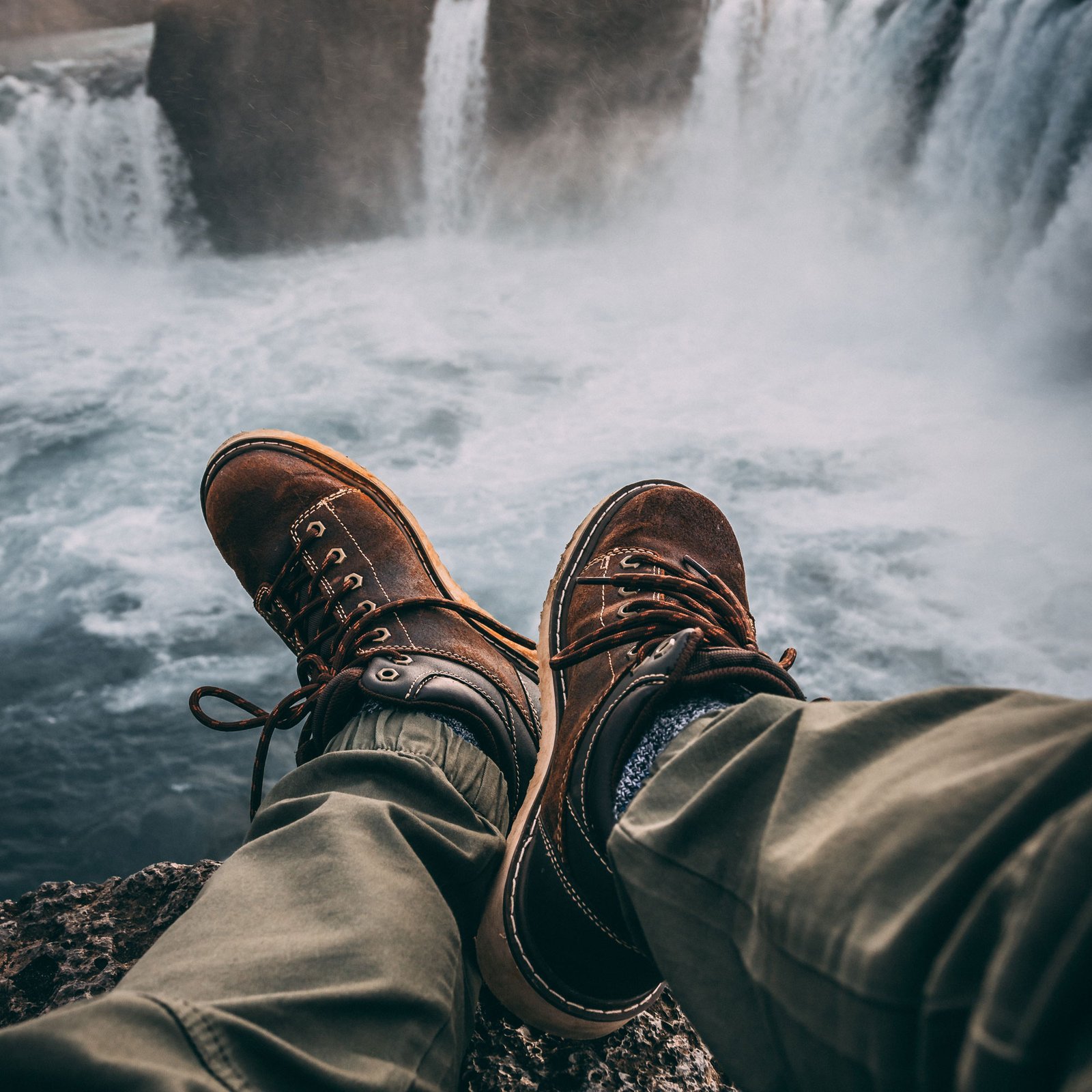 Person Sitting On Rock Near Waterfalls 1904769